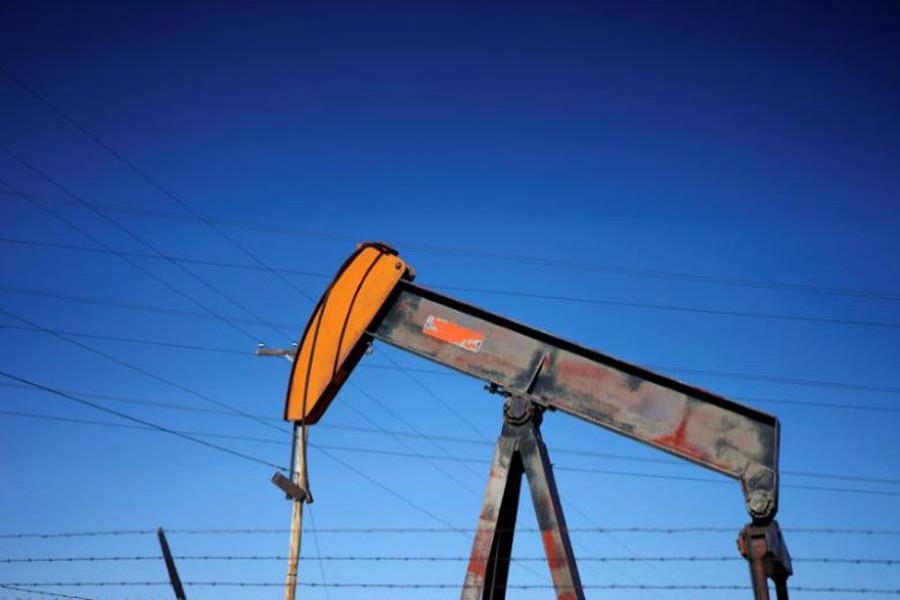An oil well pump jack is seen at an oil field supply yard near Denver, Colorado, US. 	— Reuters