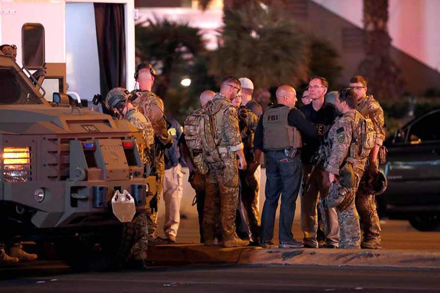 FBI agents confer in front of the Tropicana hotel-casino after a mass shooting during a music festival on the Las Vegas Strip in Las Vegas, Nevada on Sunday. - Reuters