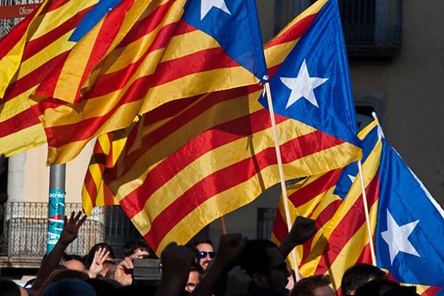 Pro-independence Catalans defy King Felipe VI's warning