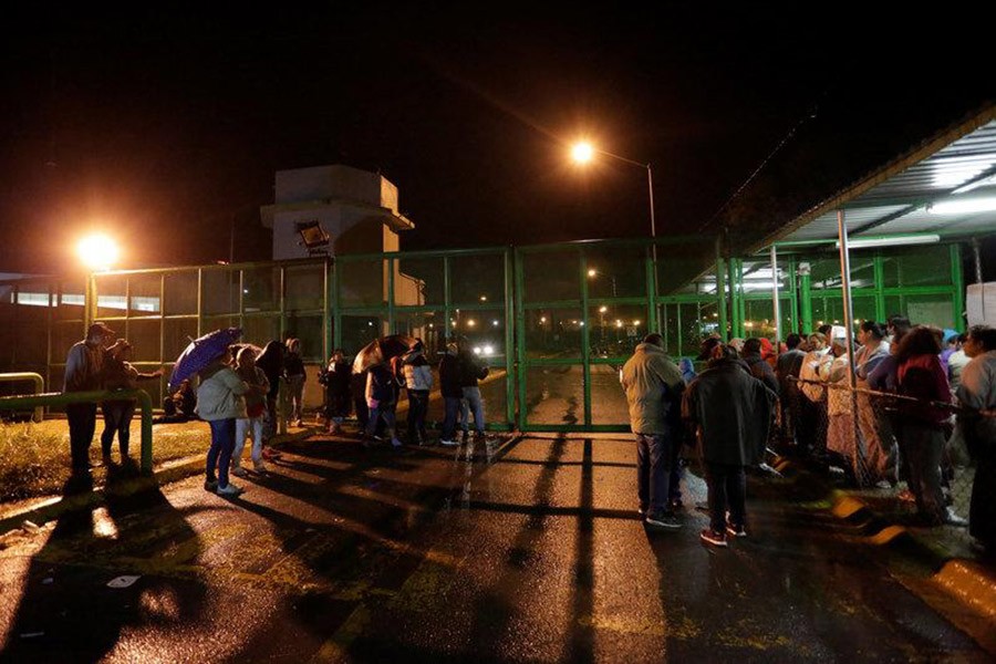 Relatives of inmates wait for news of their loved ones outside the Cadereyta state prison after a riot broke out at the prison, in Cadereyta Jimenez, on the outskirts of Monterrey, Mexico on Tuesday. - Reuters