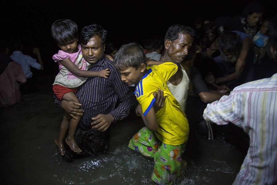 Many Rohingya refugees fleeing Myanmar arrive in Bangladesh under cover of darkness on wooden boats on the beach at Shah Porir Dwip, Teknaf, near Cox’s Bazar. Photo: UNHCR