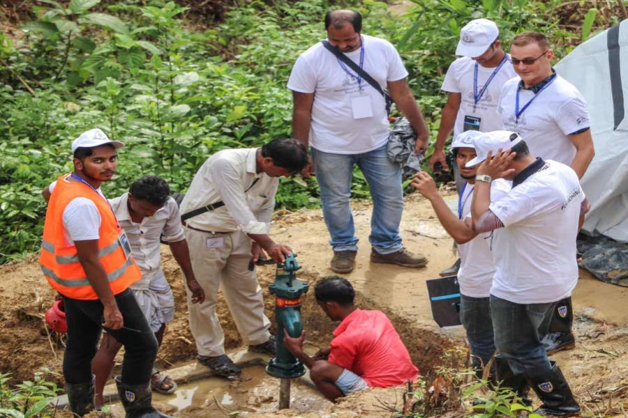 IUB team installing tube-wells in Ukhiya as part of its humanitarian activity.