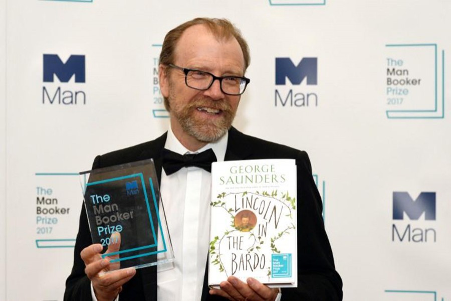 George Saunders, author of 'Lincoln in the Bardo', poses for photographers after winning the Man Booker Prize for Fiction 2017 in London, Britain on Tuesday. - Reuters photo