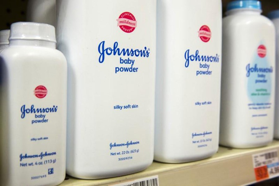 Bottles of Johnson & Johnson baby powder line a drugstore shelf in New York. - Reuters file photo
