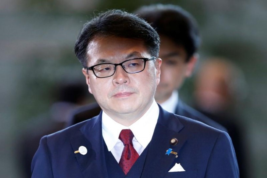 Japanese minister gives back salary over scandal
