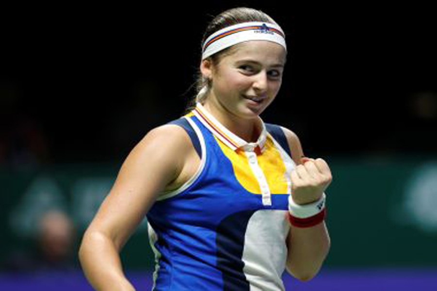 Jelena Ostapenko of Latvia celebrates winning her group stage match against Karolina Pliskova of Czech Republic during the WTA Finals tennis tournament in Singapore on Thursday.	— Reuters