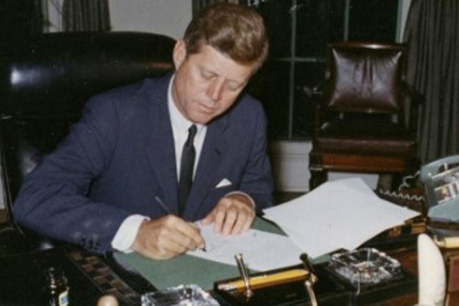 US President John F. Kennedy signs a proclamation for the interdiction of the delivery of offensive weapons to Cuba during the Cuban missile crisis, at the White House in Washington, DC in 1962. - Reuters