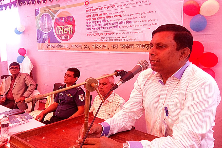 DC Gautam Chandra Pal addressing the inaugural session of the four-day Income Tax Fair-2017 arranged by the Deputy Commissioner of Taxes, Circle 19, Gaibandha, on its office premises in the town on Thursday. 	— FE Photo