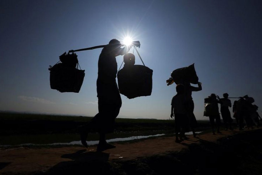 Rohingya refugees make their way to a refugee camp after crossing the Bangladesh-Myanmar border in Palong Khali, near Cox's Bazar, Bangladesh, November 3, 2017.  - Reuters photo