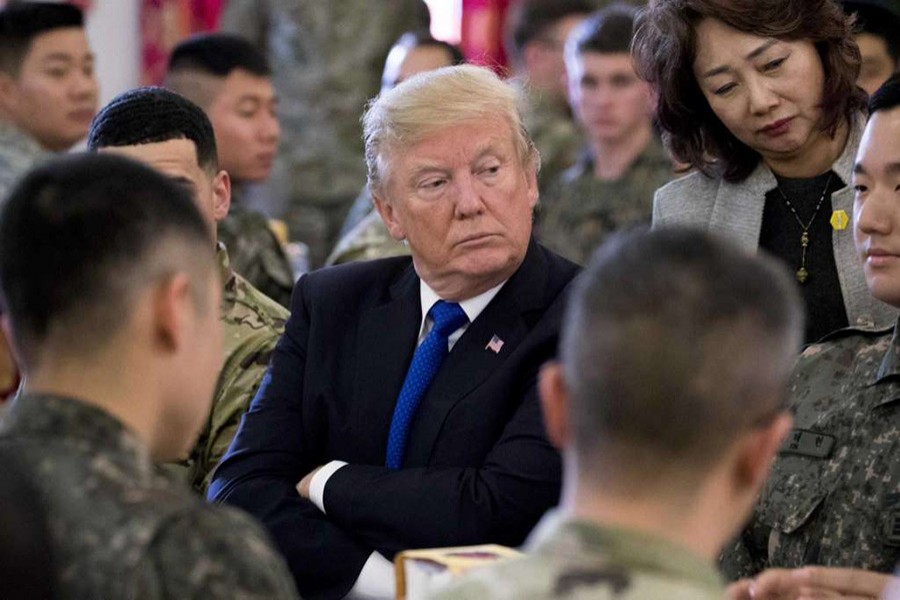 President Donald Trump has lunch with US and South Korean troops along with South Korean President Moon Jae-in (not pictured) at Camp Humphreys in Pyeongtaek, South Korea on Tuesday. - AP photo