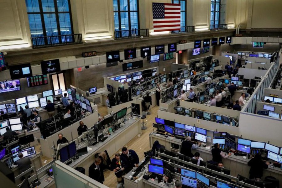 Traders work on the floor of the American Stock Exchange (AMEX) at the New York Stock Exchange (NYSE) in New York City, New York, US. 	— Reuters