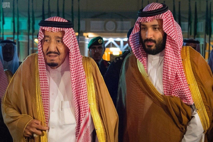 Saudi Arabia's King Salman bin Abdulaziz Al Saud walks with his son and Crown Prince Mohammed bin Salman, before King Salman leaves for Medina, in Riyadh, Saudi Arabia, November 8, 2017. Saudi Press Agency/Handout via Reuters Attention Editors