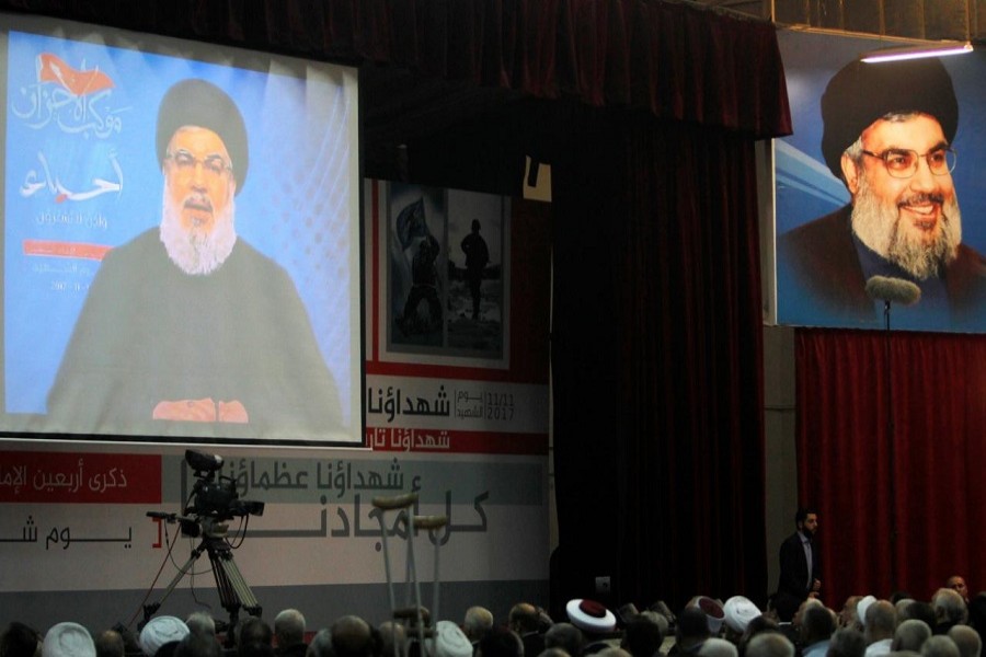 Lebanon's Hezbollah leader Sayyed Hassan Nasrallah is seen on a video screen as he addresses his supporters in Beirut, Lebanon November 10, 2017. Reuters