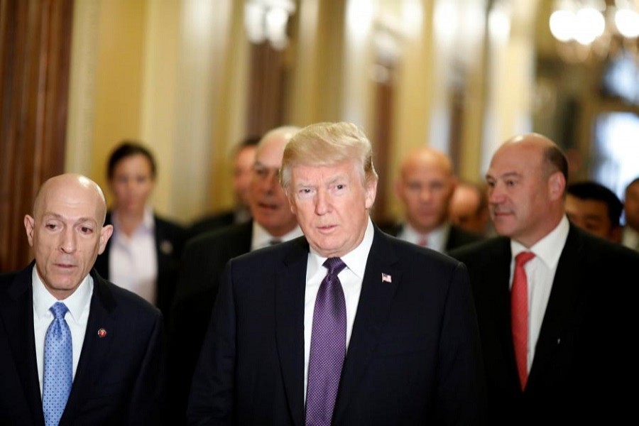 US President Donald Trump arrives with Director of the National Economic Council Gary Cohn at the US Capitol to meet with House Republicans ahead of their vote on the "Tax Cuts and Jobs Act" in Washington, US, November 16, 2017. Reuters