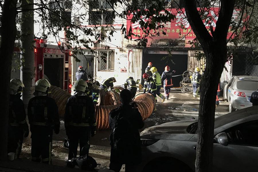 Firefighters work at the site of a fire in Daxing District of Beijing, capital of China on Saturday. - Xinhua photo