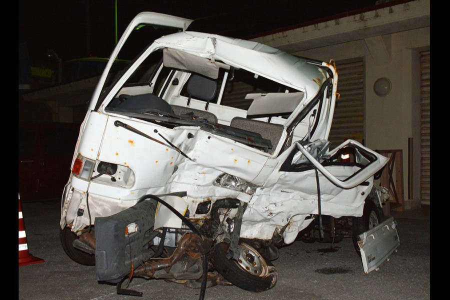 A Japanese driver's damaged vehicle is placed at a police station in Naha, Okinawa, southern Japan on Sunday. - AP photo