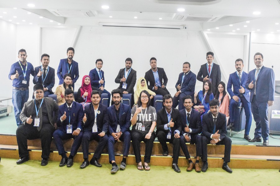 The writer (fourth from right, front row) along with other students at a  programme of Daffodil International University Business and Education Club