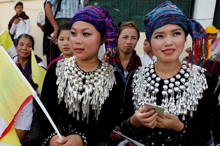 Women from Kachin State wait outside the residence of Cardinal Charles Maung Bo, Archbishop of Yangon, where Pope Francis will be staying during his visit in Yangon, Myanmar, November 27, 2017. Reuters