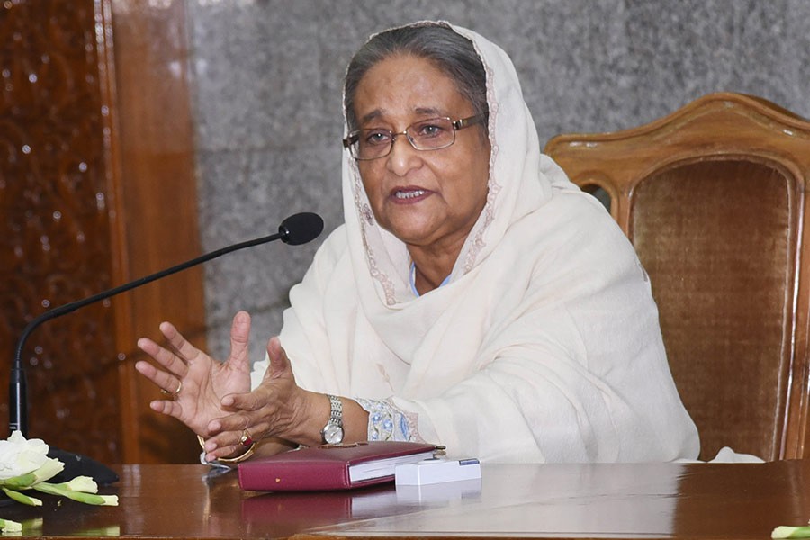 Prime Minister Sheikh Hasina addresses a function on Monday at her office. 33 commercial banks handed over blankets to PM's relief and welfare fund. -Focus Bangla Photo