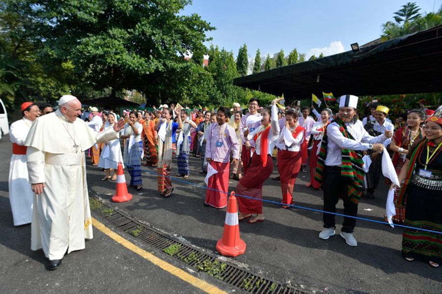 Pope Francis is welcomed upon his arrival at the airport in Yangon, Myanmar on Monday. - AP photo