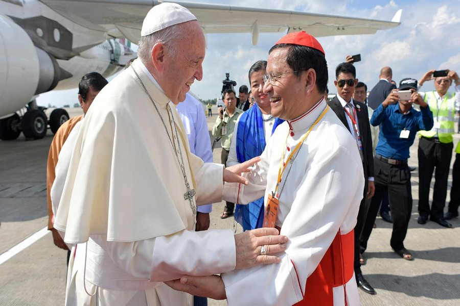 Pope Francis is welcomed as he arrives at Yangon International Airport, Myanmar on Tuesday. Photo: Reuters