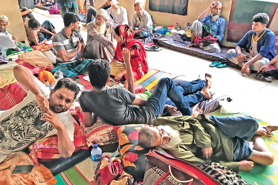 Patients along with their relatives staying on a floor at National Institute of Cardiovascular Diseases in the capital due to scarcity of beds. 	— FE Photo