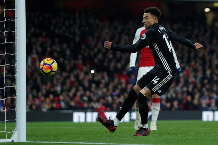 Manchester United's Jesse Lingard scores their third goal against Arsenal. - Reuters photo