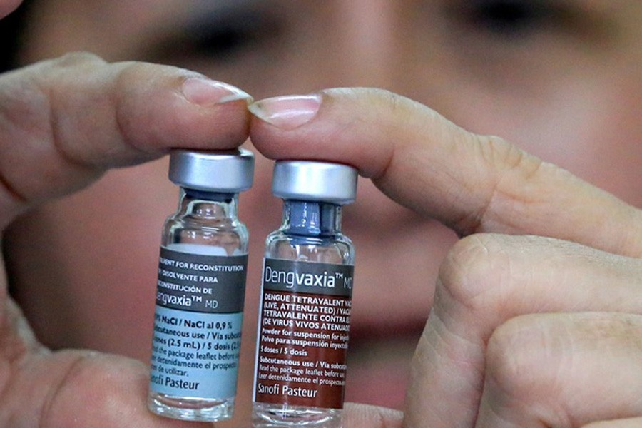 Concepcion Yusop, a national immunization program manager, shows an anti-dengue vaccine Dengvaxia inside a vaccine storage room in Sta. Cruz city, Metro Manila, Philippines December 4, 2017. REUTERS