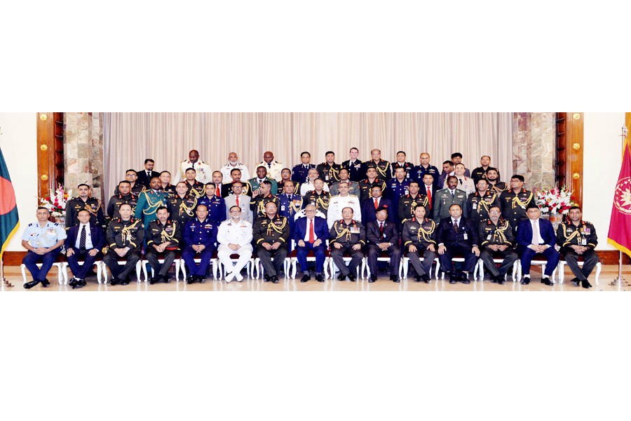 President Md Abdul Hamid poses for photograph with the participants of National Defence Course (NDC)-2017 and Armed Forces War Course (AFWC)-2017 when they made a courtesy call on him at Bangabhaban on Wednesday.	— Focus Bangla