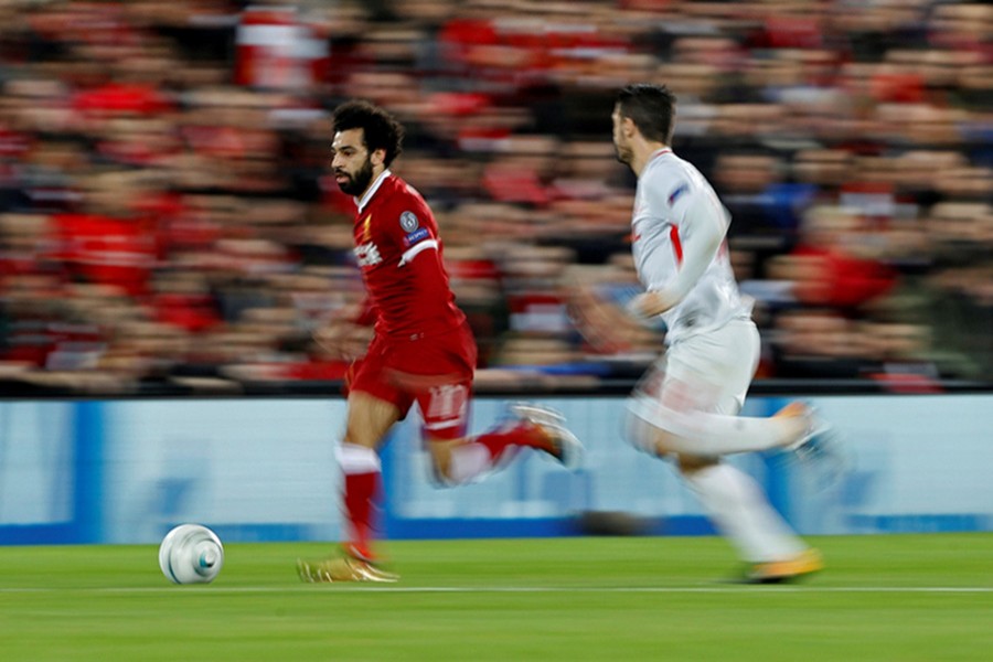 The Reds will join Chelsea, Manchester City, Manchester United, and Tottenham in Monday's draw at UEFA headquarters in Switzerland. Reuters photo shows Liverpool's Salah and Spartak Moscow's Salvatore Bocchetti in action.