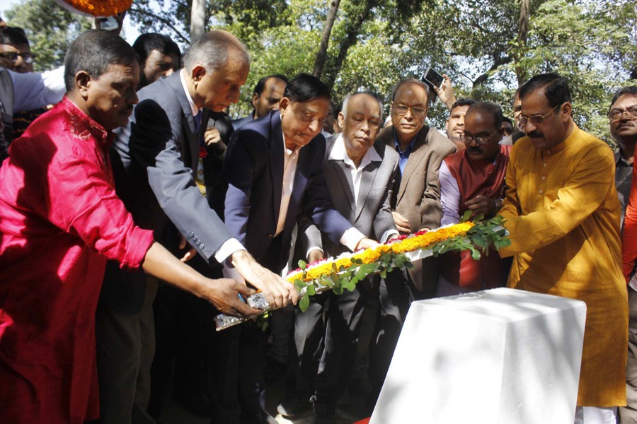 Disaster Management and Relief Minister Mofazzal Hossain Chowdhury Maya places a wreath at a monument at Suhrawardy Uddyan