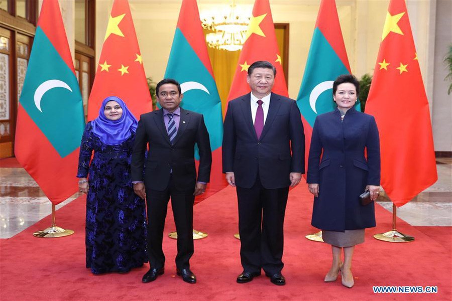 Chinese PresidentXi Jinping(2nd R) and his wife Peng Liyuan (1st R) pose for group photos with Maldives President Abdulla Yameen Abdul Gayoom (2nd L) and his wife at the Great Hall of the People in Beijing, capital of China, Dec. 7, 2017, photo: Xihua