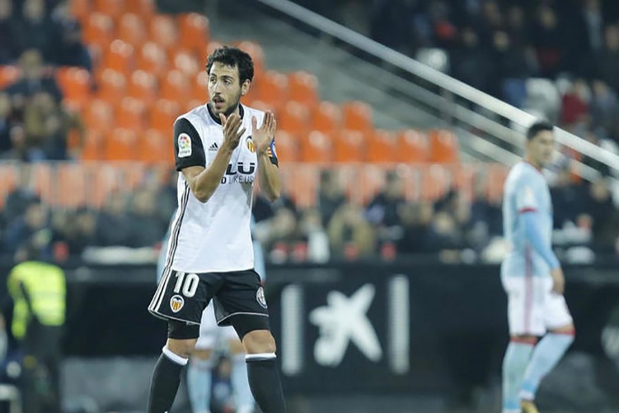 Valencia are second in the standings, moving two points behind Barcelona who have 36 and visit Villarreal on Sunday. Collected photo shows Valencia captain Dani Parejo.