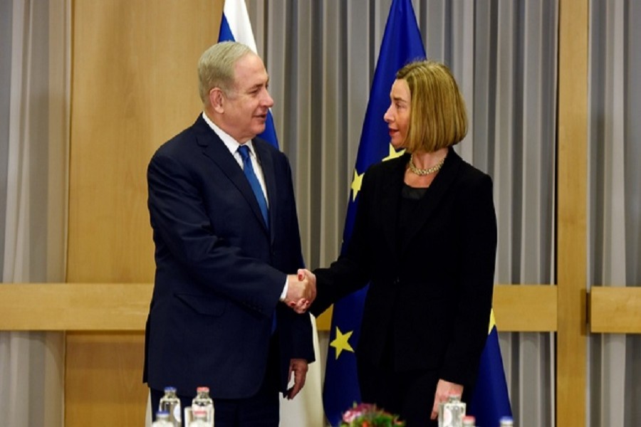EU foreign policy chief Federica Mogherini shakes hands with Israeli Prime Minister Benjamin Netanyahu at the European Council headquarters in Brussels, Belgium, Dec 11, 2017. Reuters
