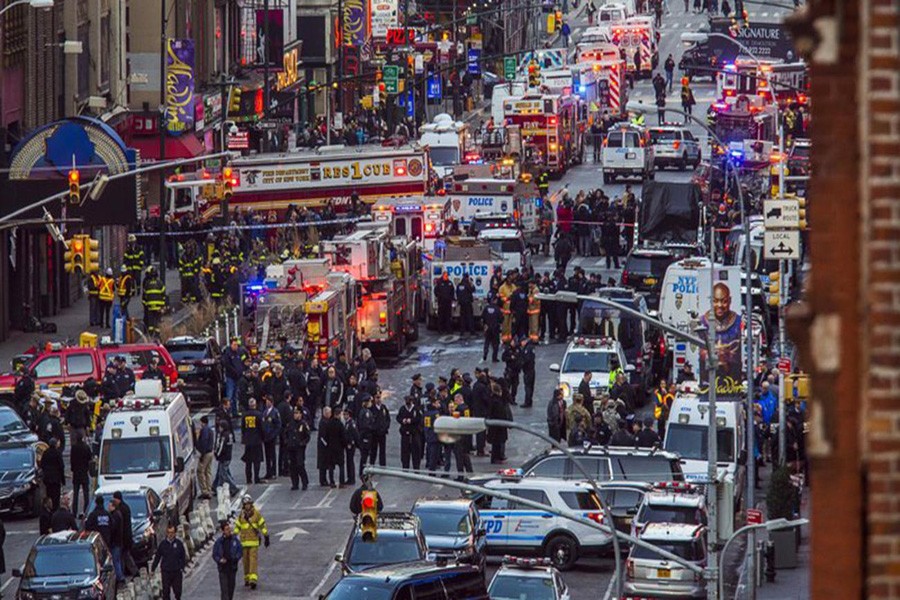 Law enforcement officials work following an explosion near New York’s Times Square on Monday, December 11, 2017. Photo: AP