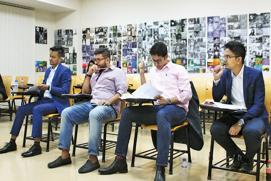 Judges during a round of the financial modelling event held at North South University campus recently