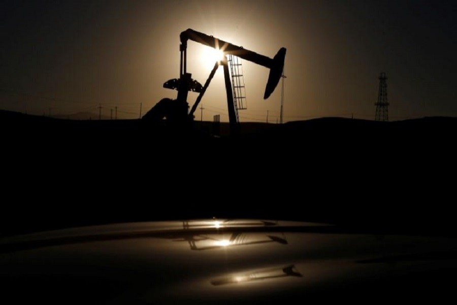 A pump jack is seen at sunrise near Bakersfield, California October 14, 2014. Reuters/Files