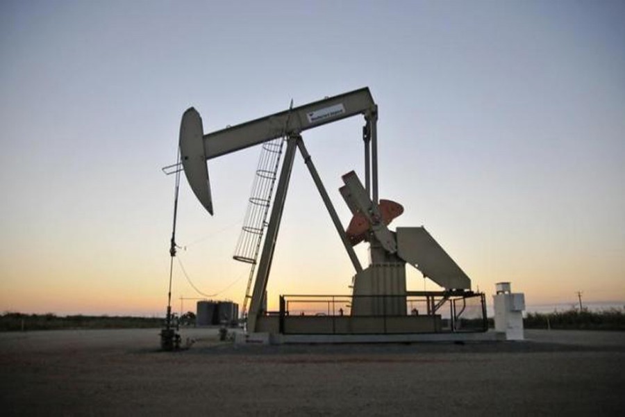 A pump jack operates at a well site leased by Devon Energy Production Company near Guthrie, Oklahoma, US. 	— Reuters