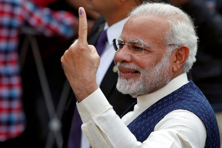 India's Prime Minister Narendra Modi shows his ink-marked finger after casting his vote outside a polling station during the last phase of Gujarat state assembly election in Ahmedabad, India, December 14, 2017. (Reuters Photo)