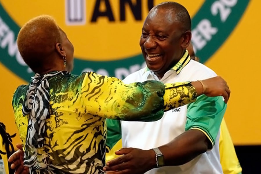 Cyril Ramaphosa greets an ANC member during the party conference in Johannesburg on Monday. (Reuters Photo)