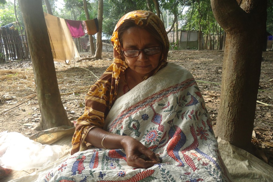 Nurjahan Begum is busy doing needlework. 	— FE Photo