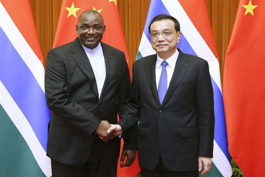 Chinese Premier Li Keqiang (R) meets with visiting Gambian President Adama Barrow in Beijing, capital of China, Dec. 22, 2017. Xinhua.
