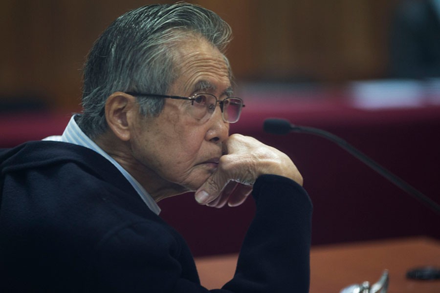 Former Peruvian President Alberto Fujimori, photographed through a glass window, at his trial on the outskirts of Lima, Peru, in June 2016. (AP)