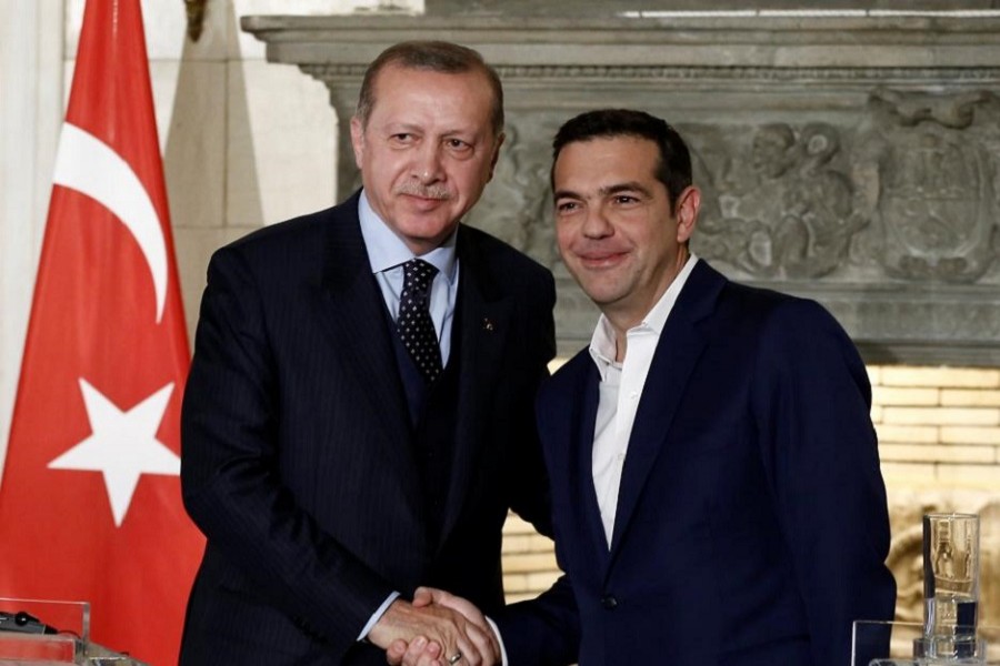 Greek Prime Minister Alexis Tsipras and Turkish President Tayyip Erdogan attend a press conference at the Maximos Mansion in Athens, Greece December 7, 2017. Reuters