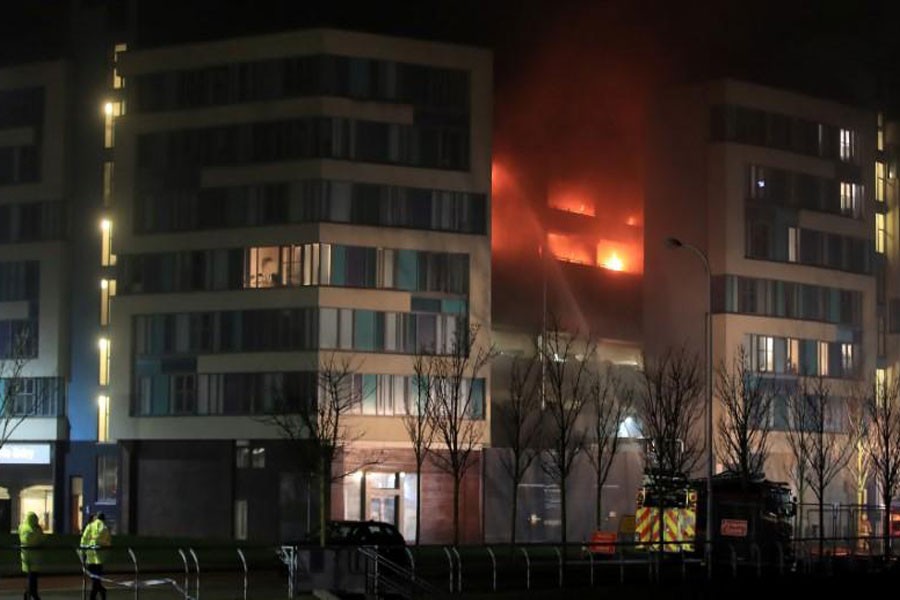 Firefighters tackle a fire during a serious blaze in a multi-storey car park in Liverpool, Britain, December 31, 2017. (REUTERS)