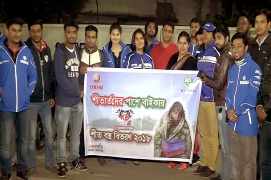 Yamaha distributes winter clothes in city