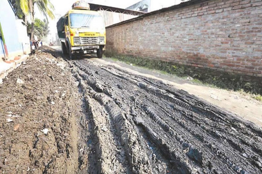 BOGRA: A miserable view of BSCIC road, causing untold sufferings to passers-by and vehicles at Fulbari under Sadar upazila of Bogra district.	— FE photo