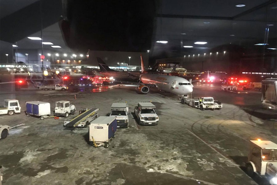 Emergency services arrive at a site where two planes collided at Toronto's Pearson Airport, Canada, January 5, 2018 in this still image taken from social media video. (REUTERS)