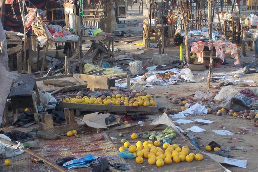 Fruits and scattered stalls are seen at the Muna Garage after two male suicide bombers detonated the bombs in Maiduguri, Nigeria, on Wednesday. - Reuters photo