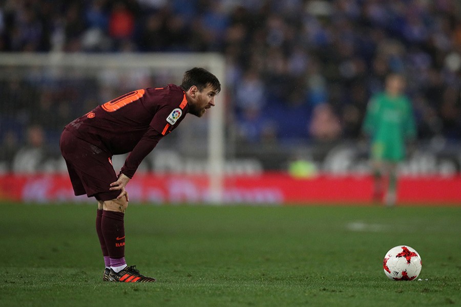 Lionel Messi cuts a dejected figure during derby clash against Espanyol on Wednesday. - Reuters photo